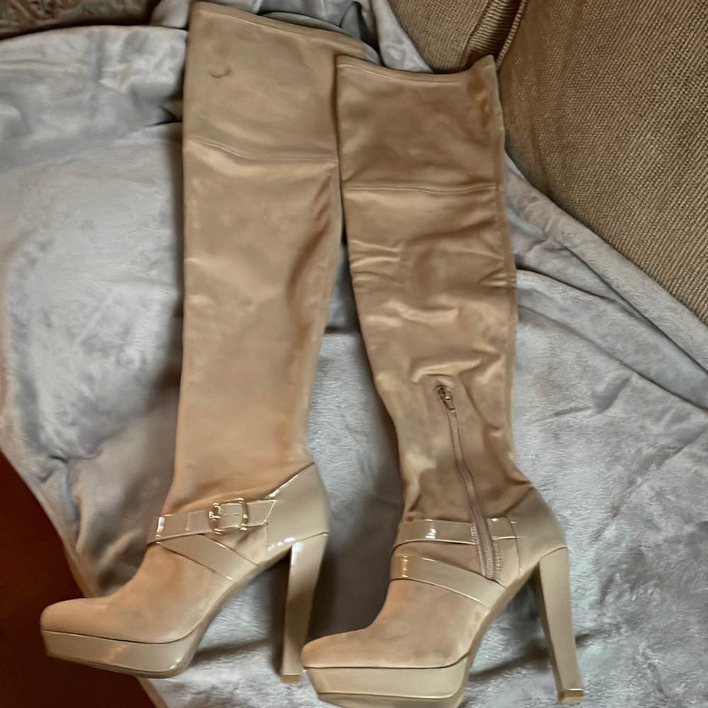Beige suede over the knee, mid thigh boots. Women’s size 8. Excellent condition.